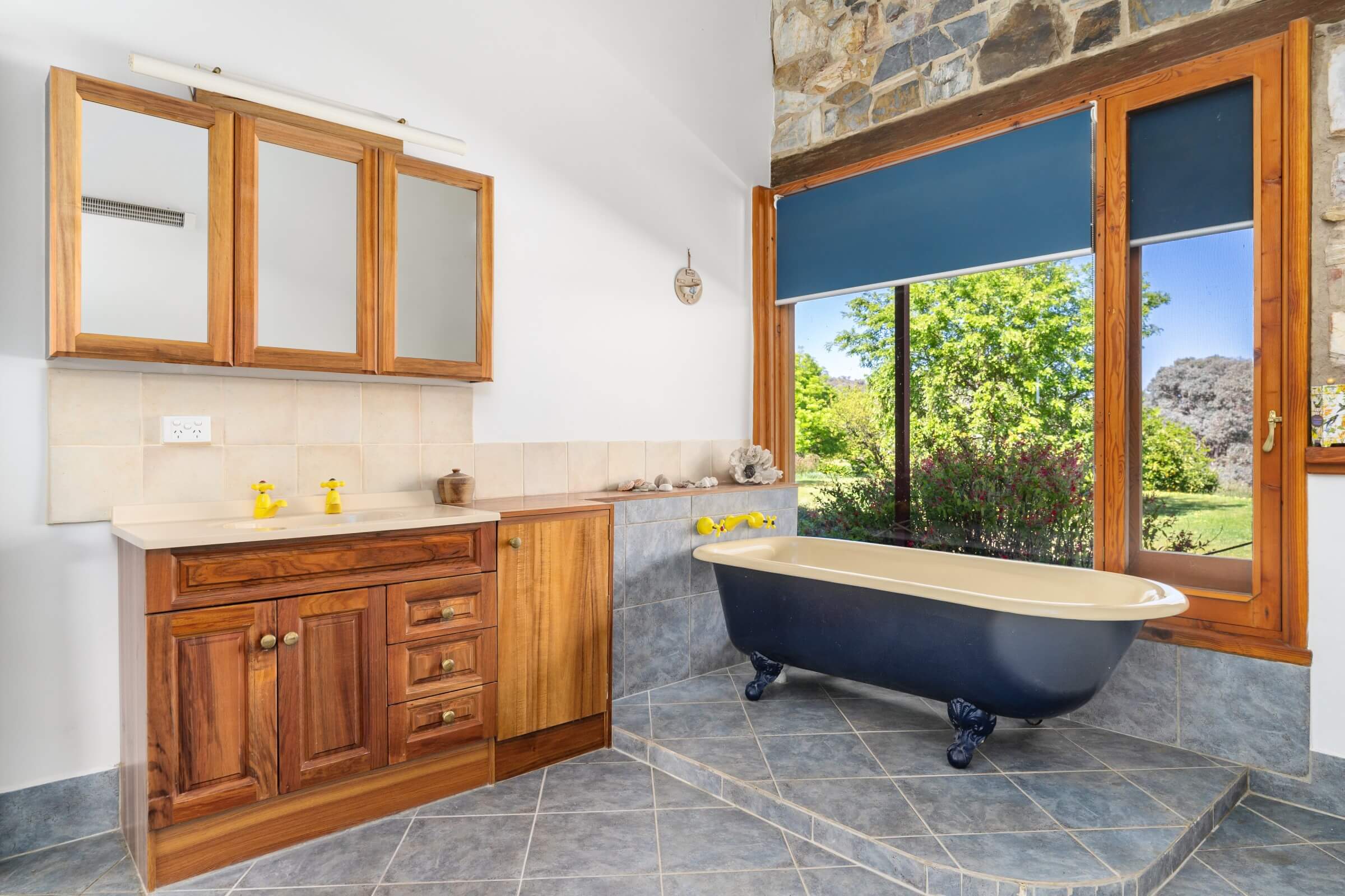 A view of the bathroom including a bath