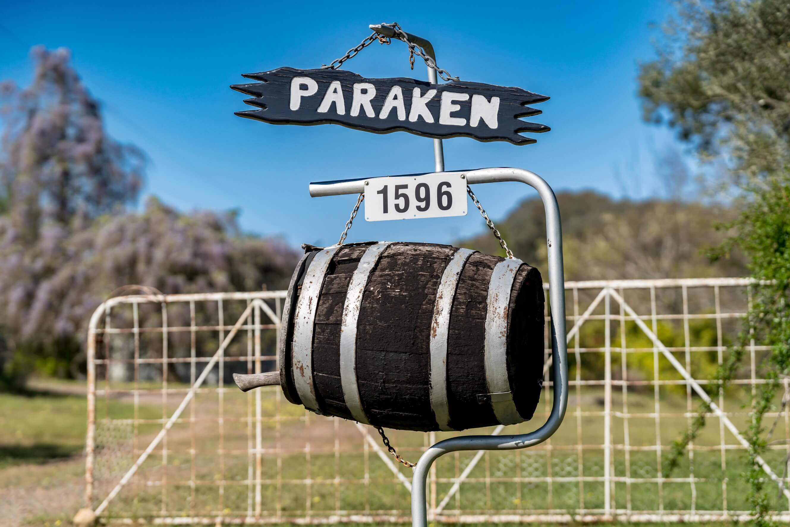 A photo of the property gate entrance and mailbox