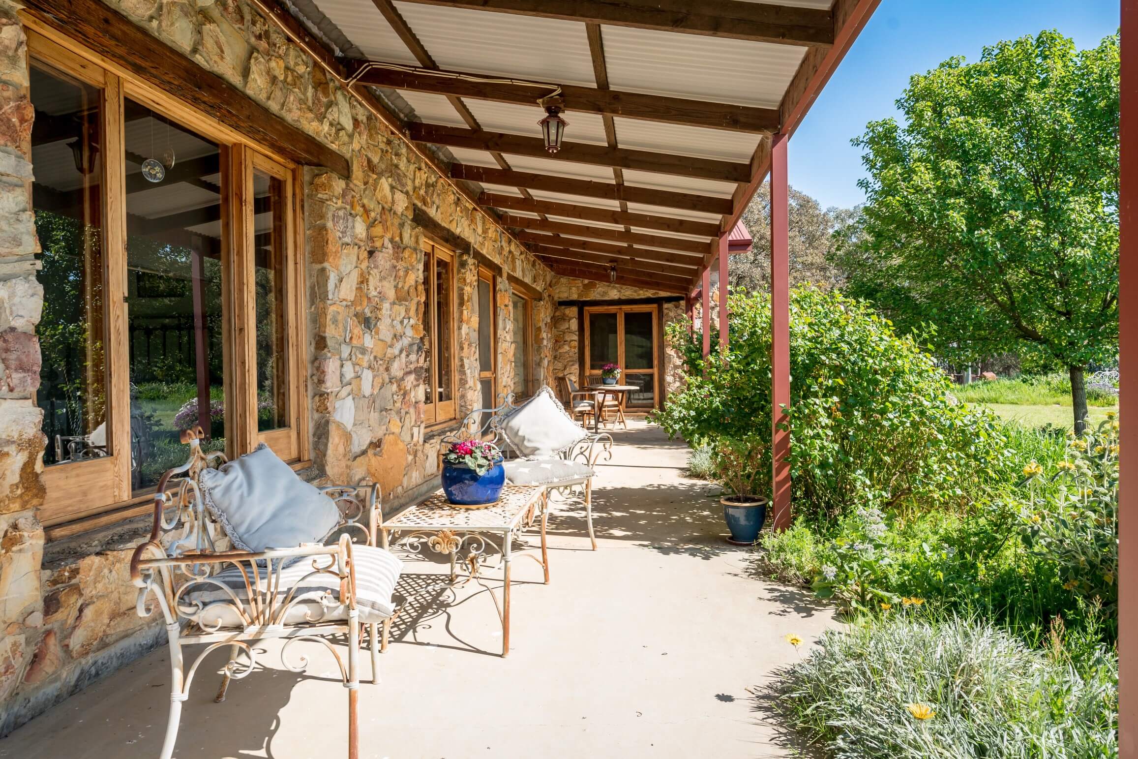 A photo underneath the property home patio with outdoor chairs