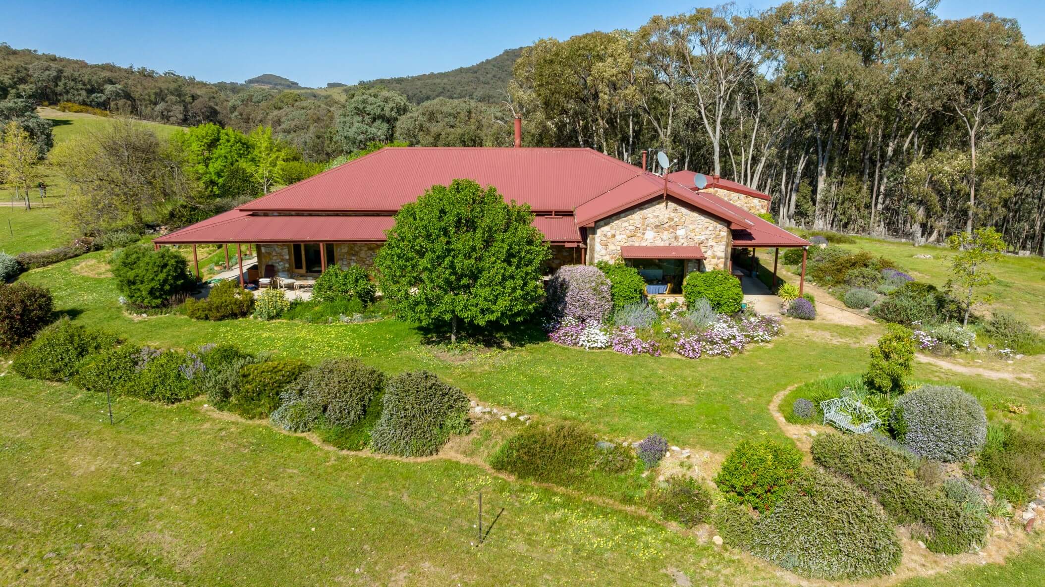 An aerial view of the property home and its surroundings