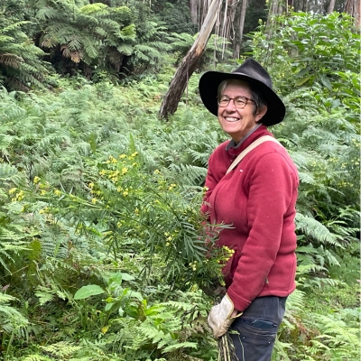 Landholder stands amongst bush conserved on her land