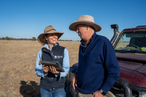 Landholder talks with BCT conservation officer over an iPad