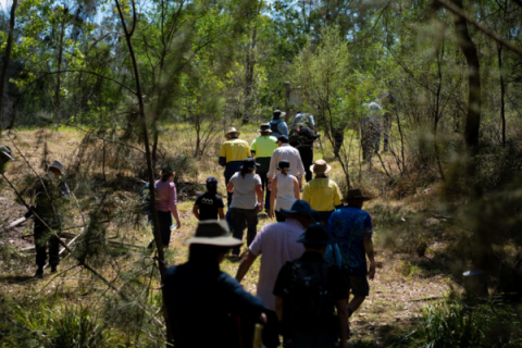 Volunteers walk away from the camera ready to partake in conservation work