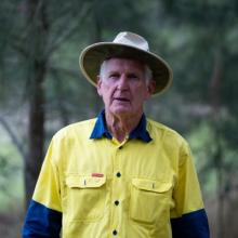 Close up of a man in a high vis work shirt and hat